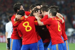 Spain players celebrating as Puyol scores vs Germany.