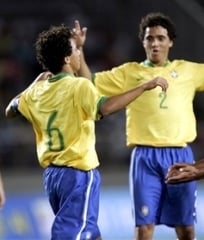 Rafael da Silva in N.2 jersey, celebrates with his twin brother Fabio da Silva under a U-17 Brazilian jersey.