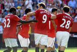 Dimitar Berbatov celebrates with his Manchester United team mates after scoring against Chelsea in the Community Shield.