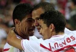 Sevilla players celebrate against Barcelona in the Spanish Super Cup.