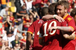 AS Roma player celebrating during an Italian Seria A match.