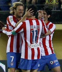 Atletico Madrid's Diego Forlan celebrates with his team mates.