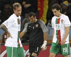 Portugal players reacting following their last 16 defeat to Spain at the 2010 FIFA World Cup