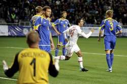 Euro 2012 qualifying - Kazakhstan players react in disappointment as they concede against Turkey