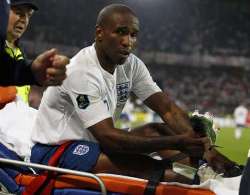 Tottenham Hotspur striker Jermain Defoe stretched off against Switzerland