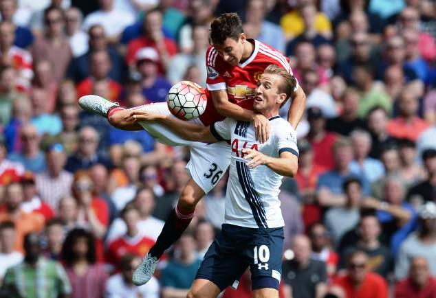 Matteo Darmian of Manchester United fights for the ball with Tottenham's Harry Kane 