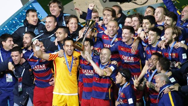 Barcelona players lift the Club World Cup in Japan