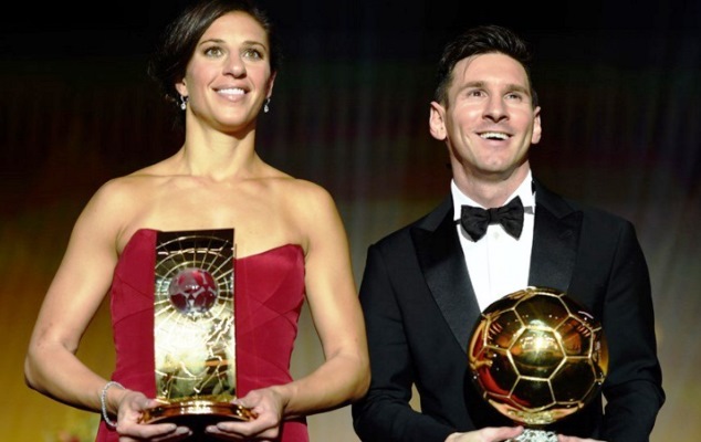 Messi poses with the Ballon d'Or trophy alongside Carli Llyod, who won the World Womens' Footballer of the Year 