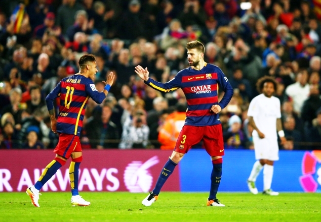 Pique celebrates his opening goal for Barca in El Clasico last weekend