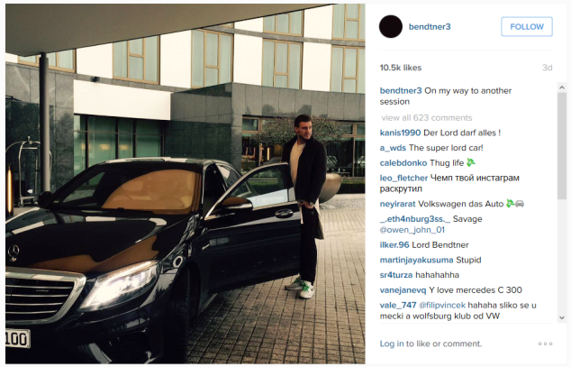 Bendtner poses next to a Mercedes Benz