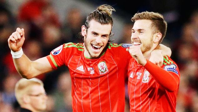 Bale (right) and Aaron Ramsey celebrate one of their goals for Wales