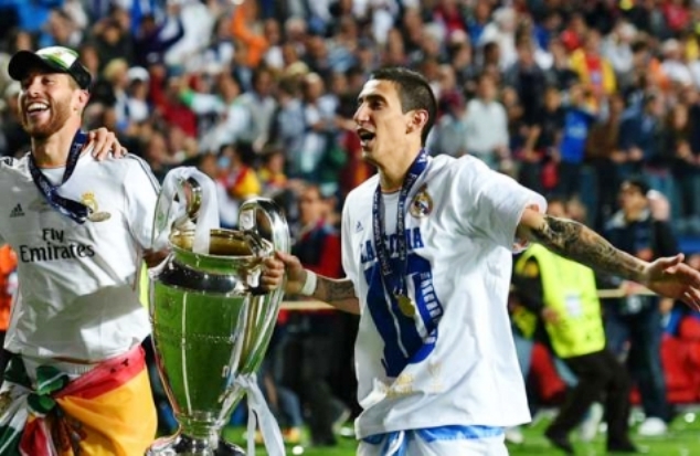 Di Maria (right) celebrates winning the Champions League title in 2014 alongside Real Madrid captain Sergio Ramos