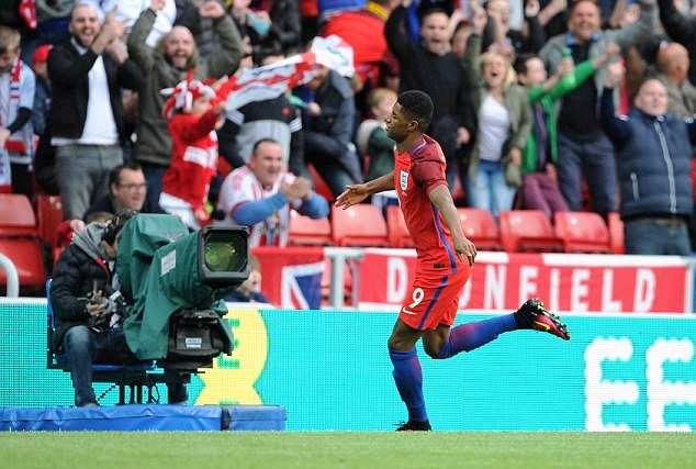 Rashford celebrates his goal for England on his debut