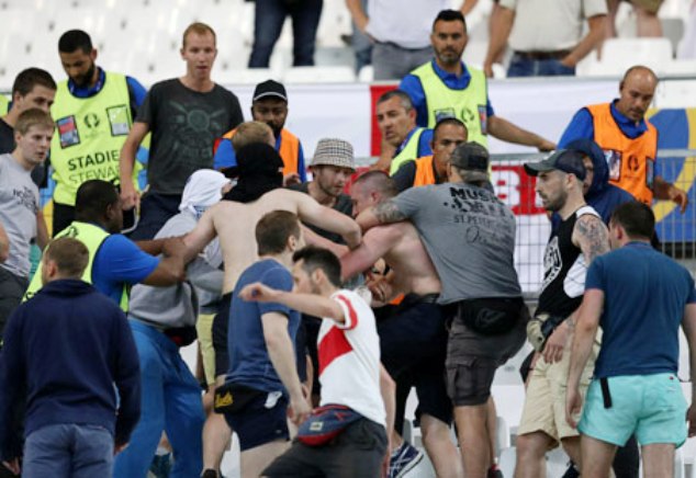 England and Russia fans fight inside Stade Velodrome