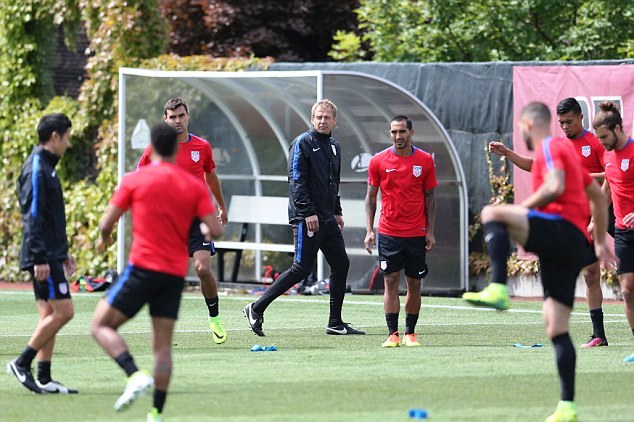 Klinsmann (center) oversees a training session with the USA national football team