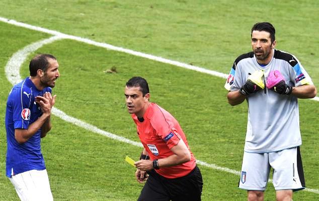 Italian goalkeeper Gianluigi Buffon reacts after receiving a yellow card in their last 16 match against Spain