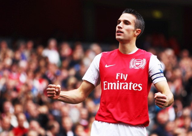 Robin Persie celebrates on his goals for Arsenal in the Premier League