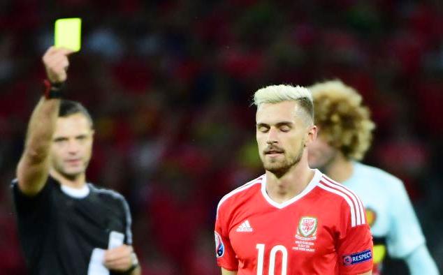 Ramsey is shown a yellow card during the Wales vs Belgium quarter-final clash