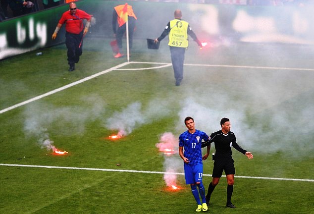 Mark Clattenberg impressed with his player-handling skills during the Croatia vs Switzerland match when fans threw fire crackers into the pitch