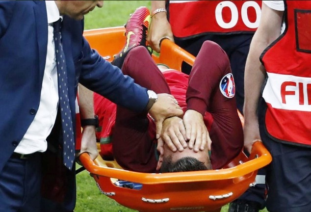 A tearful Ronaldo is carried off the pitch on a stretcher after suffering a knee injury in the Euro 2016 finals