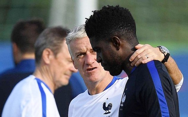 Umtiti (left) receives instructions from France coach Didier Deschamps during a previous training session at the Euro 2016