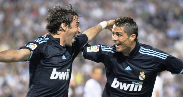 Raul (left) celebrates one of his goals alonside Cristiano Ronaldo during his spell at the club