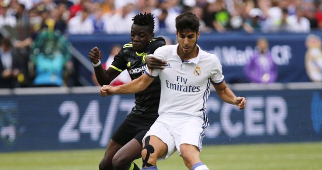 Asensio in action for Real Madrid against Baba Rahman of Chelsea in their pre-season club friendly