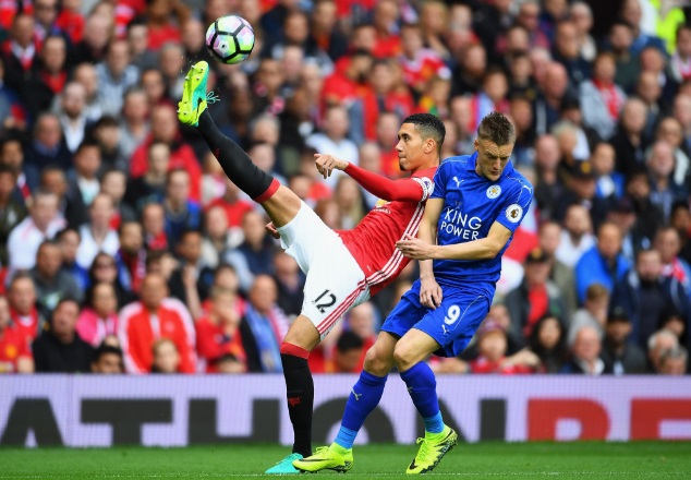 Vardy (right) fights for the ball with Man Utd defender Chris Smalling during their Premier League clash last weekend at Old Trafford. The Foxes were mauled 4-1 by the Red Devils
