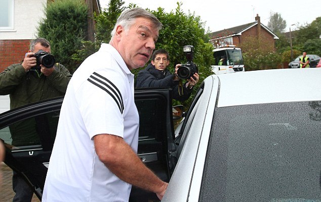Sam Allardyce boards a waiting car on his way to vacation after losing the England job