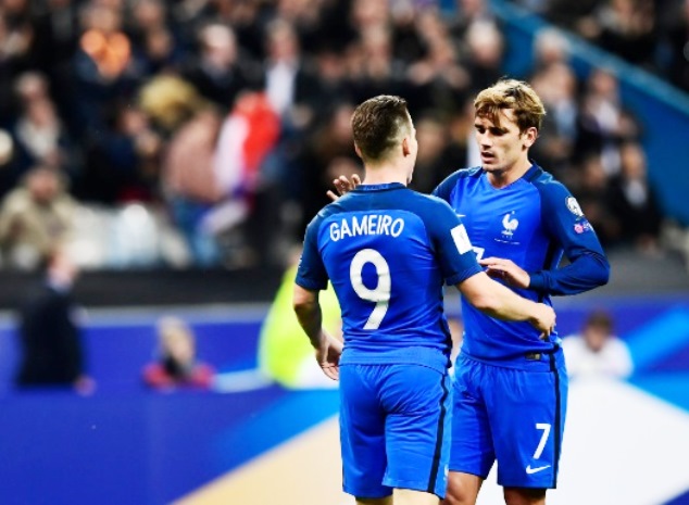 The man of the moment celebrates his first goal for France with teammate Griezmann