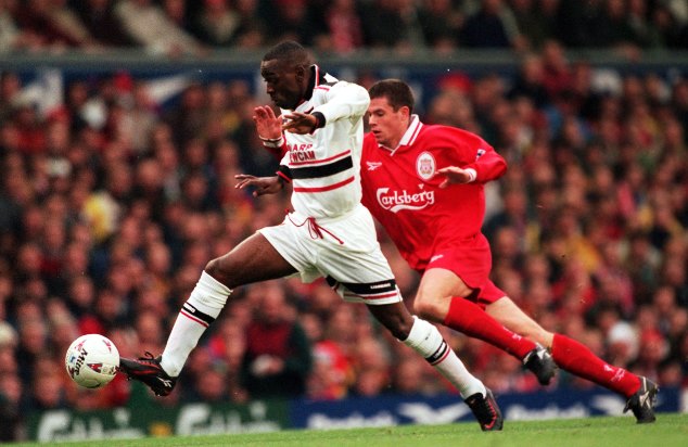 Andy Cole (left) fights for the ball with Liverpool legend Jamie Carragher back in 1999