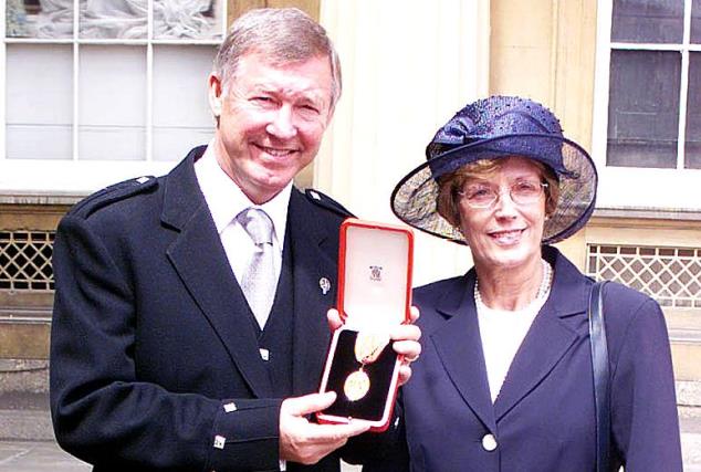 Sir Alex Ferguson and wife Cathy after he was knighted by Britain's Queen Elizabeth II during