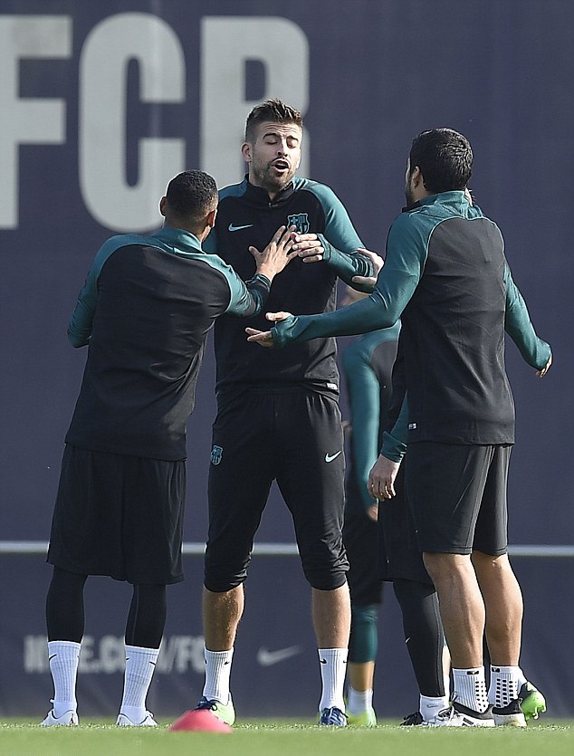 Neymar appears to hold Pique back as he confronts Luis Suarez