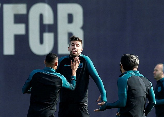 Pique appears to be angered by something Suarez did or said during the training session