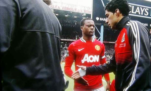Suarez refuses to shake Patrice Evra's hand after the former was fined by the FA for his racial conduct