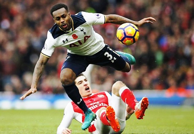 Bellrin (on the ground) is tackled by Danny Rose of Spurs in the London derby