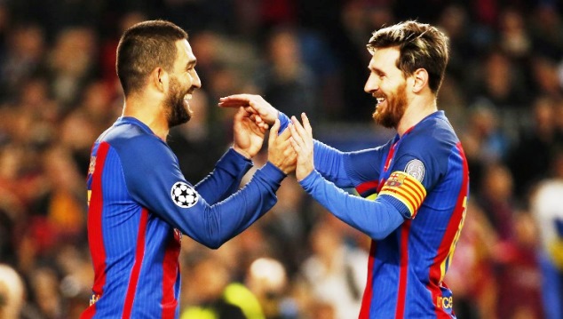 Turan (left) celebrates his third goal against Gladbach with teammate Lionel Messi