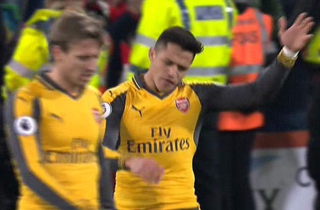 Sanchez storms off the pitch, throwing his arms up in the air with anger after the draw with Bournemouth
