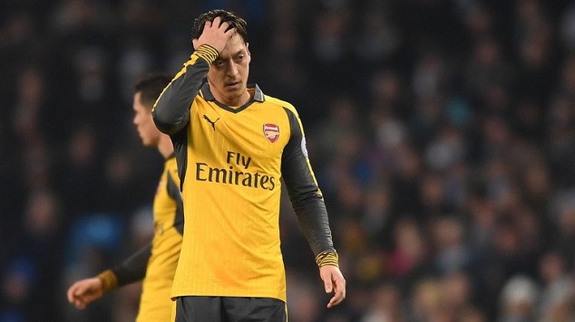 The German midfielder reacts to Arsenal conceding against Bayern at the Allianz Arena