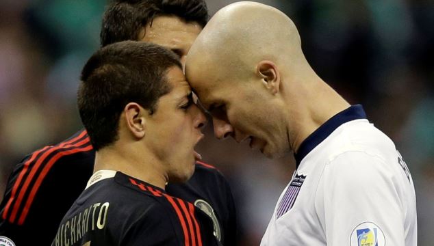 Javier Hernandez of Mexico confronting Michael Bradley of the United States