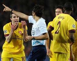 Arsenal's Robin Van Persie tried to make Referee Massimo Busacca understand that he did not hear his whistle due to the massive noise at Barcelona's Camp Nou, but the red card decision was never reversed.