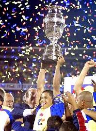 Ivan Cordoba lifting the 2001 Copa America trophy after his solitary strike downed Mexico in the final.