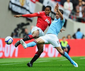 Manchester United and Manchester City play against each other in the 2011 FA Community Shield.
