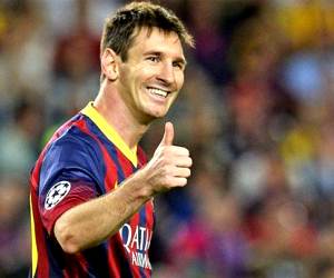 Big grin: Lionel Messi celebrates his hat-trick against Ajax on Matchday 1 of the UEFA Champions League.