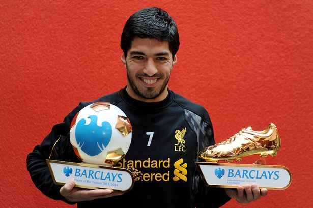 Luis Suarez posing with his EPL awards