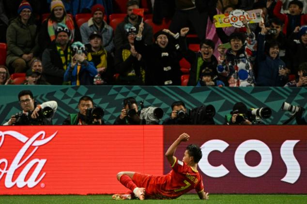 Ten-player China beat Haiti to stay alive after wild World Cup clash