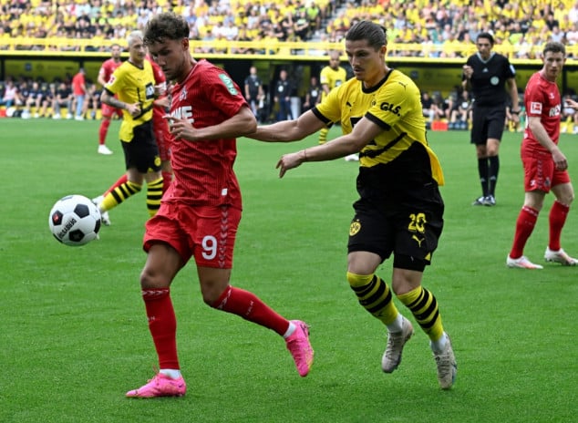 Malen strikes late to hand Dortmund victory over Cologne