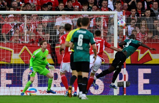 Grimaldo returns Leverkusen to top with win at Wolfsburg