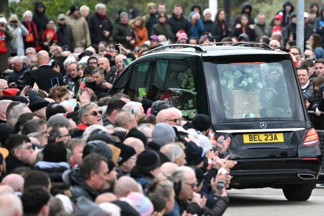 Thousands line Manchester streets to bid final farewell to Bobby Charlton