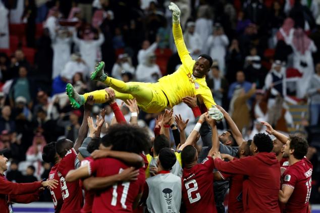 Goalkeeper saves Qatar in shootout to set up Iran semi at Asian Cup